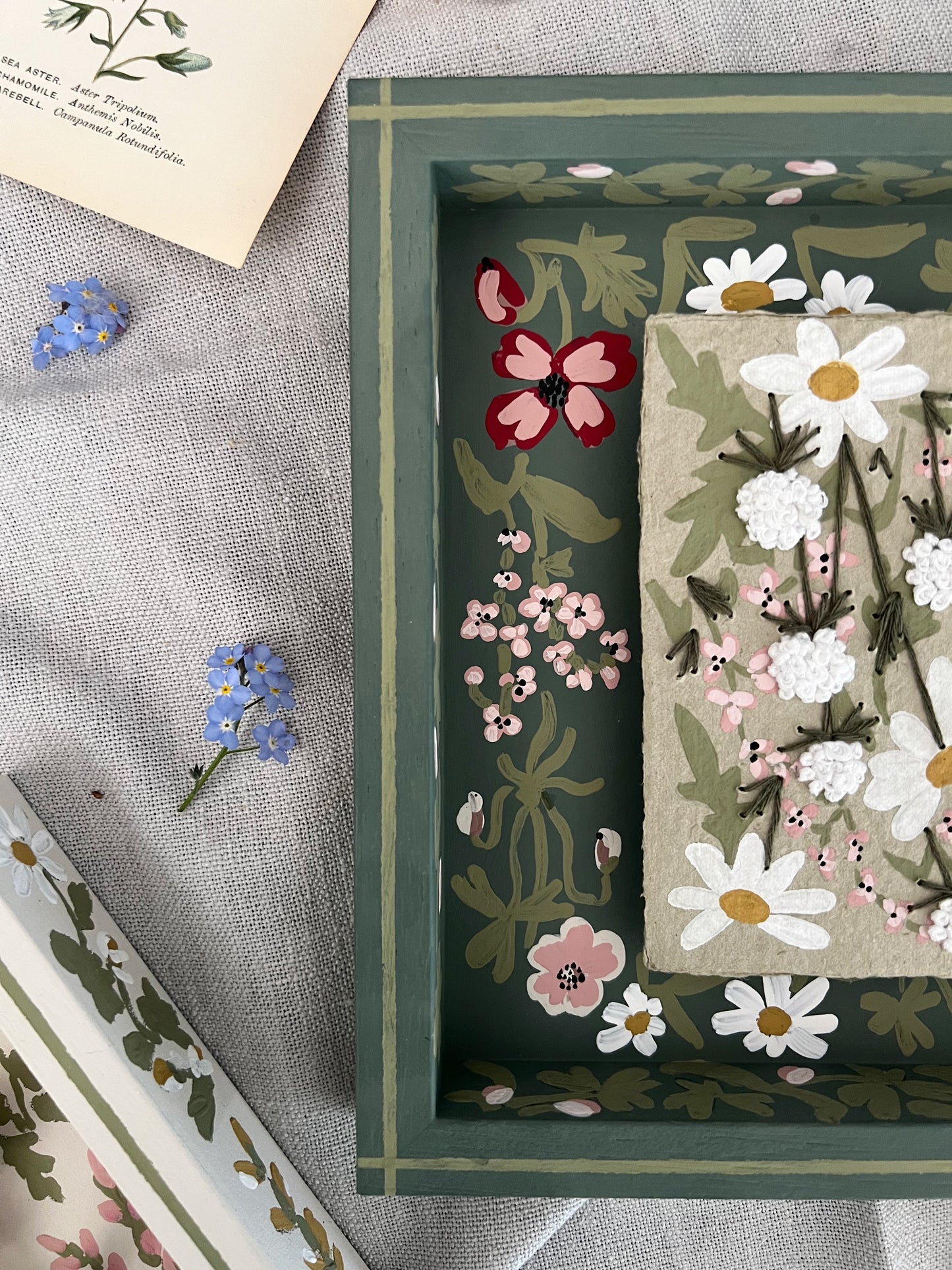 001 - Embroidered wild flowers on Handmade Paper with painted Frame.
