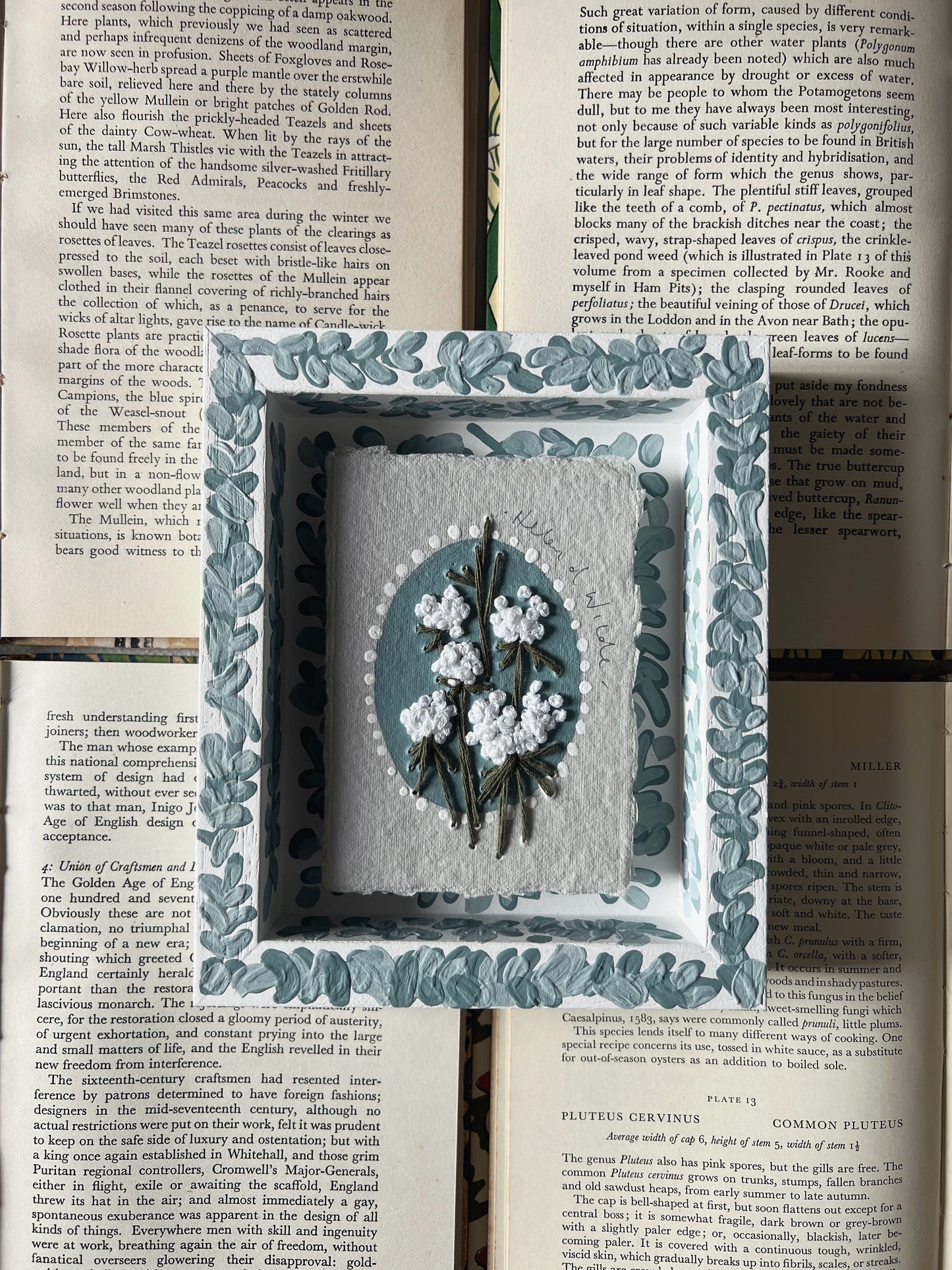 000 - Embroidered wild flowers on Handmade Paper - Framed in Blue.