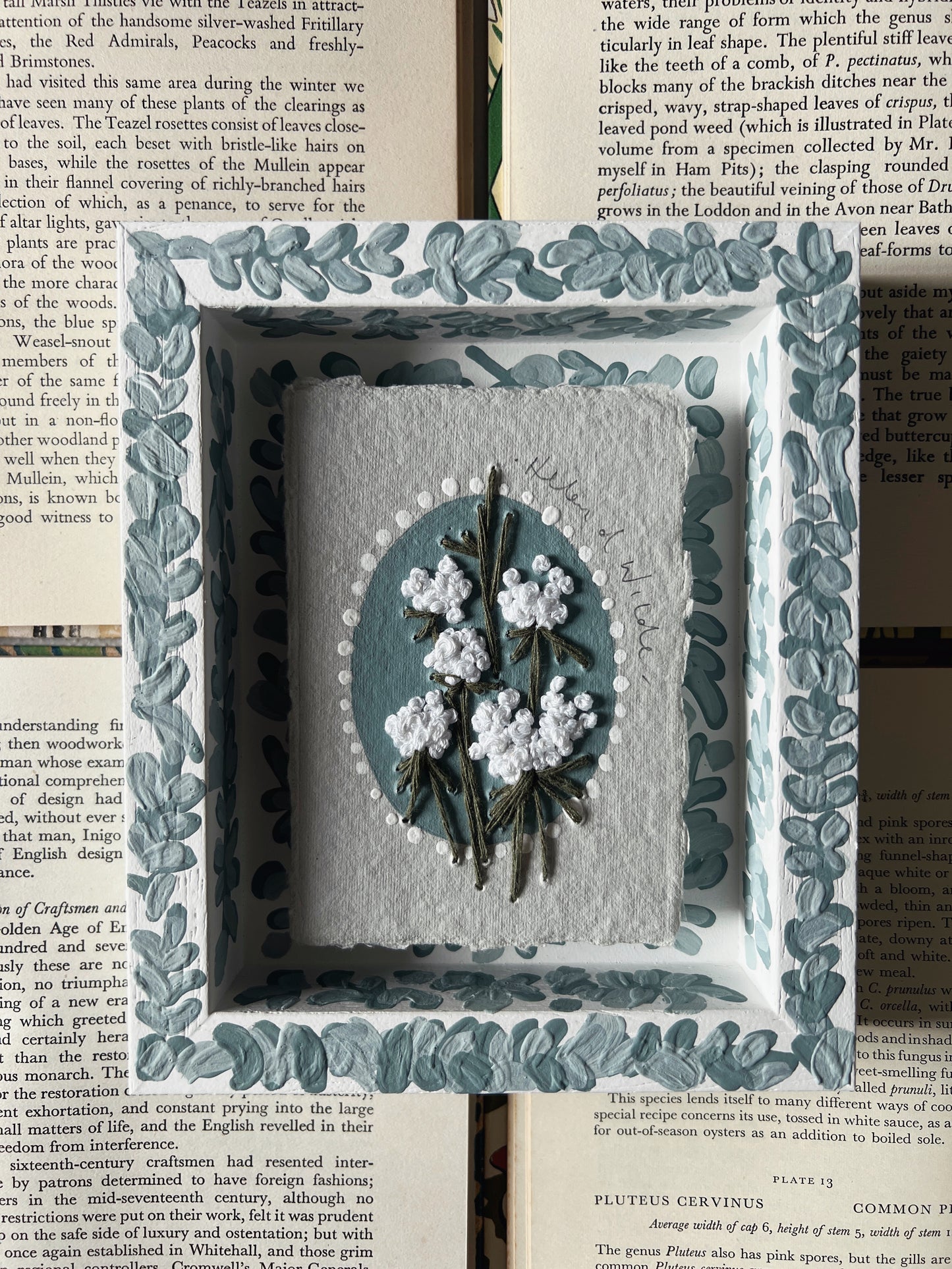 000 - Embroidered wild flowers on Handmade Paper - Framed in Blue.
