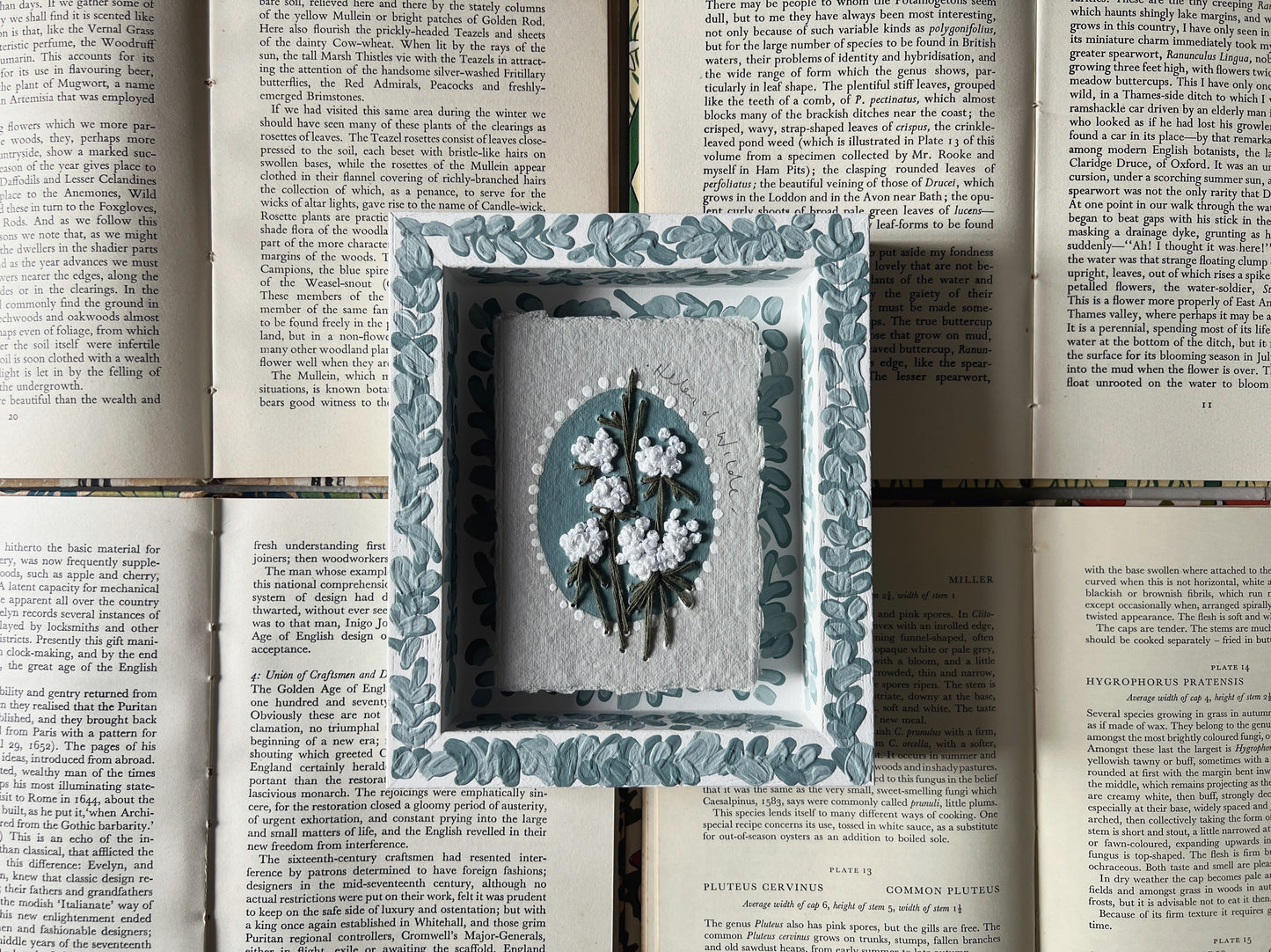 000 - Embroidered wild flowers on Handmade Paper - Framed in Blue.