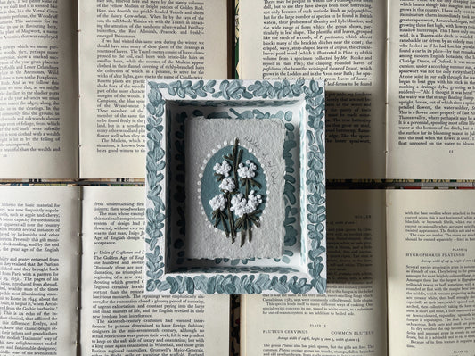 000 - Embroidered wild flowers on Handmade Paper - Framed in Blue.